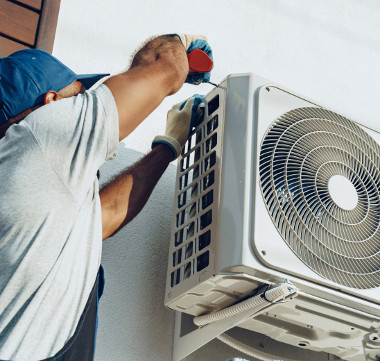 Tradesperson installing air conditioning